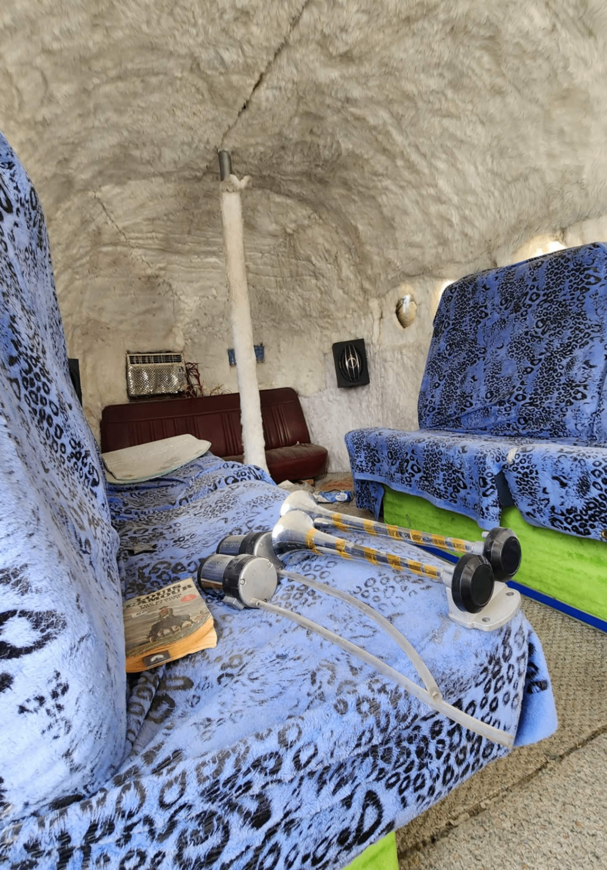 Psychedelic Falcon 21 interior — fur-lined cabin with leopard print seating
